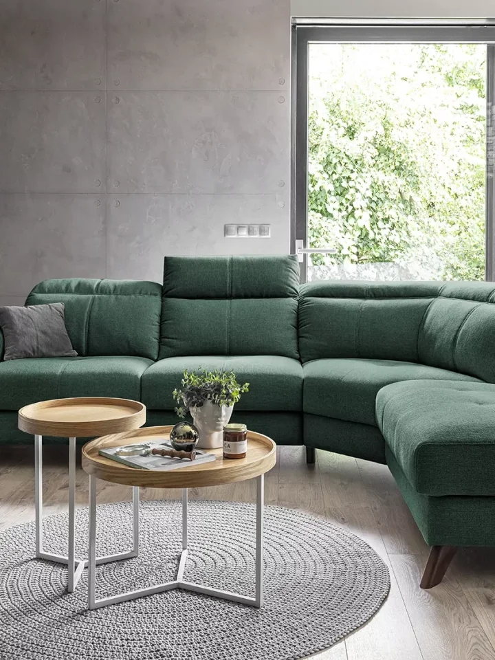 How to style a dark green velvet sofa for a luxurious living room