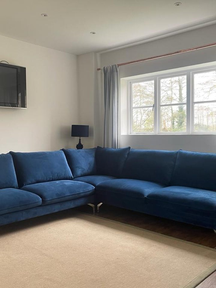 Corner sofa navy blue: maximizing space without compromising style