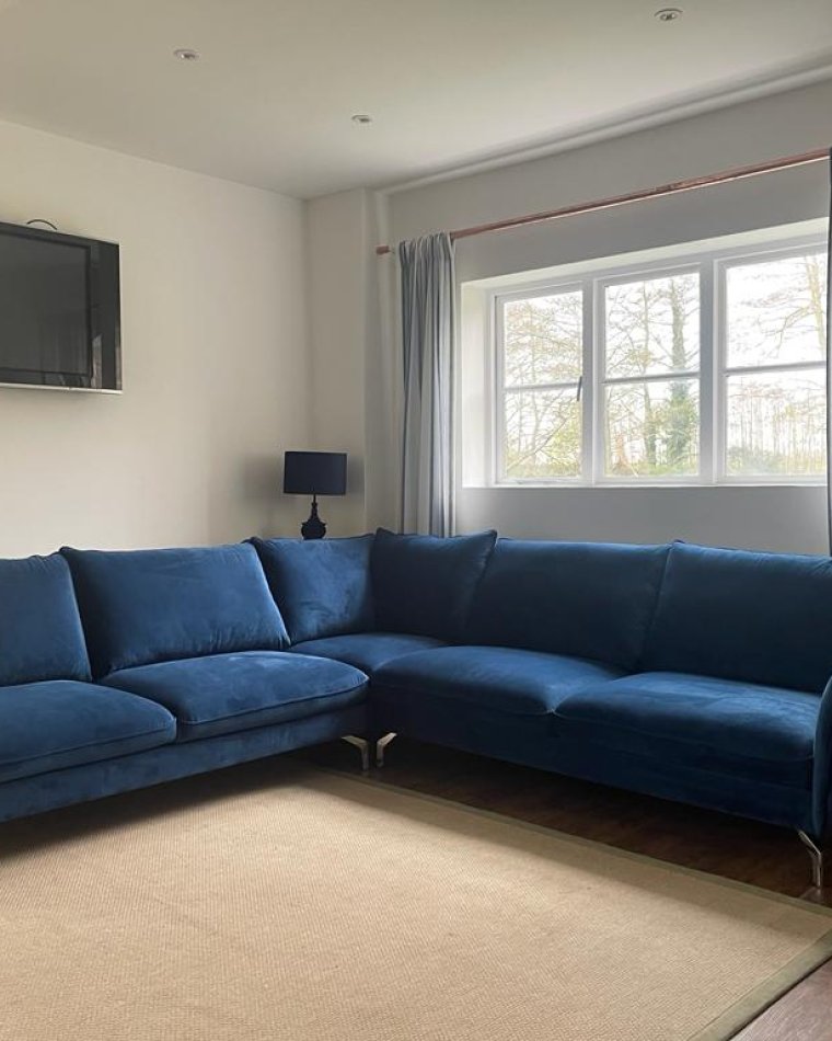 Corner sofa navy blue: maximizing space without compromising style